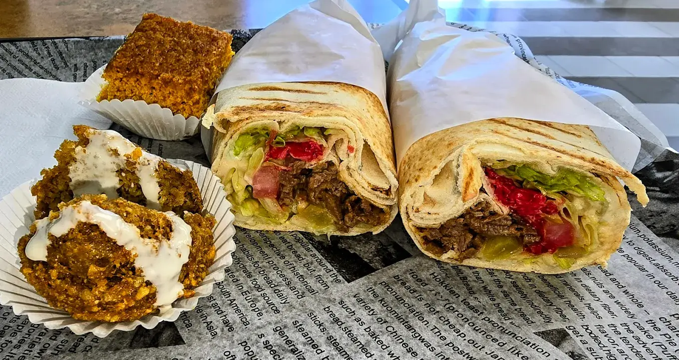 Beef Donair Platter with Lebanese rice and toppings at Shawarmero Calgary